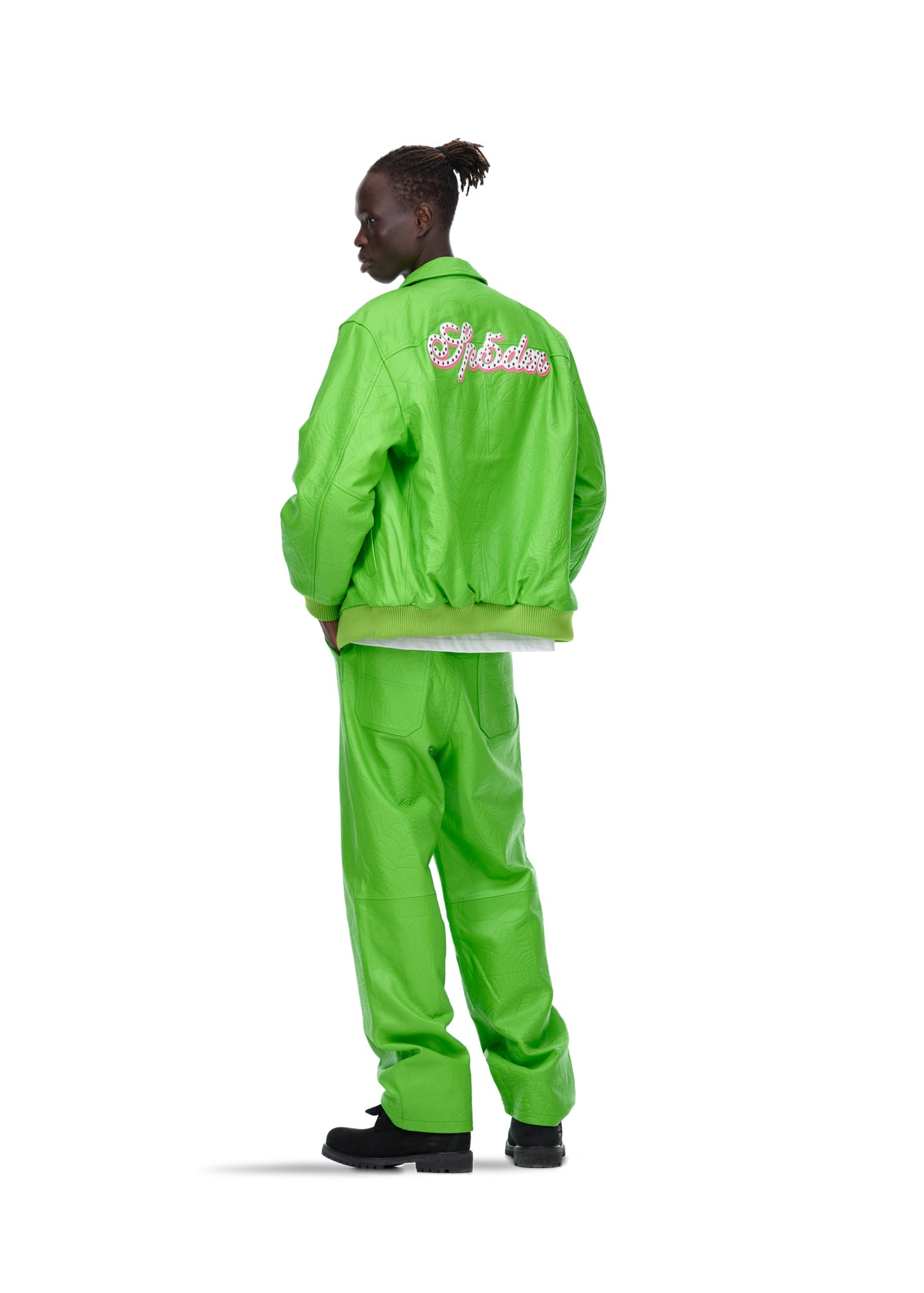 Styled full look view of SP5DER Debossed Web Leather Jacket in Green