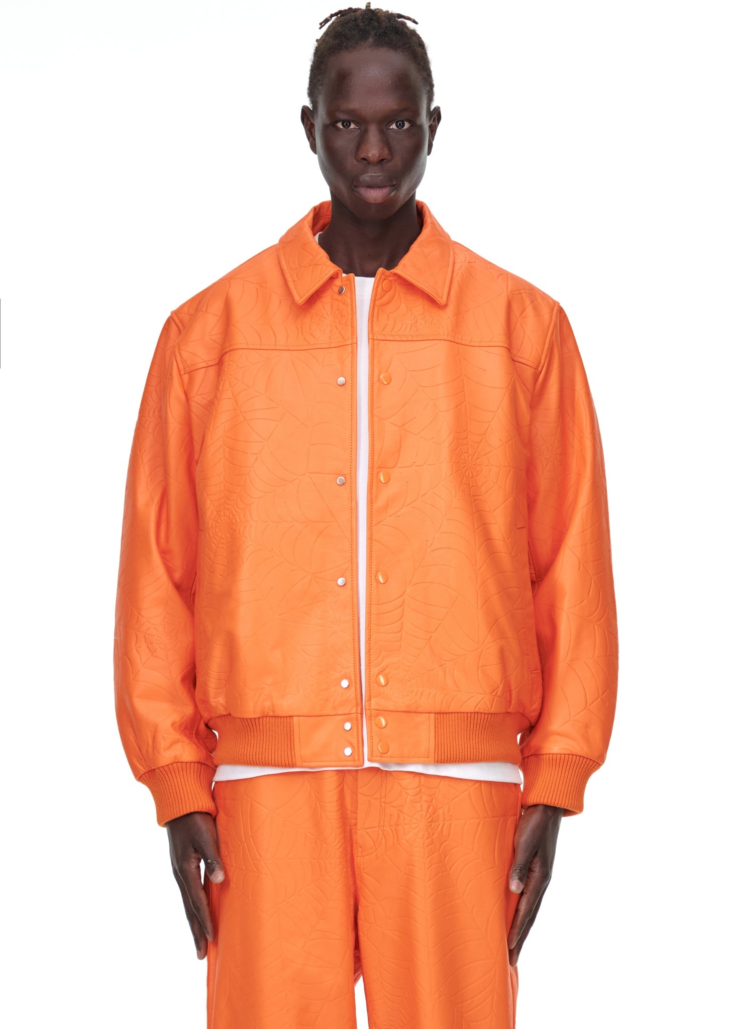 Additional angle view of SP5DER Debossed Web Leather Jacket in Orange