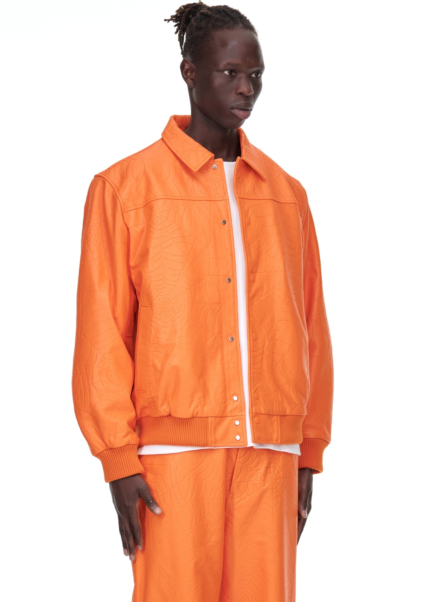 Side view of SP5DER Debossed Web Leather Jacket in Orange