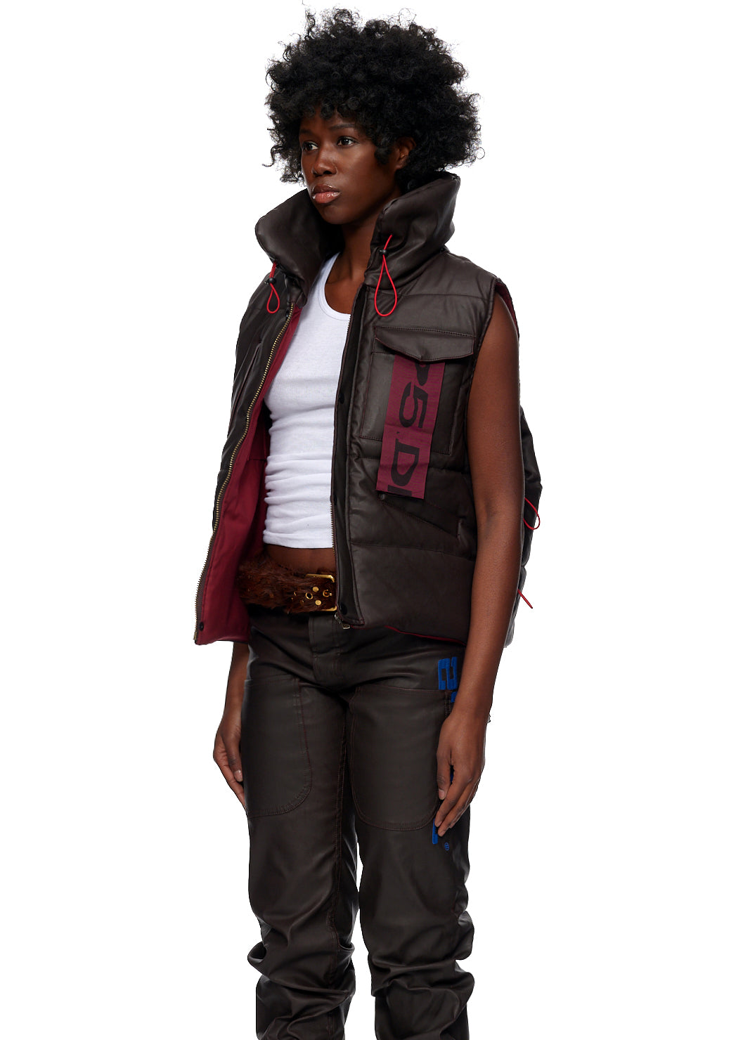 Styled full look view of SP5DER Hooded Puffer Vest in Brown