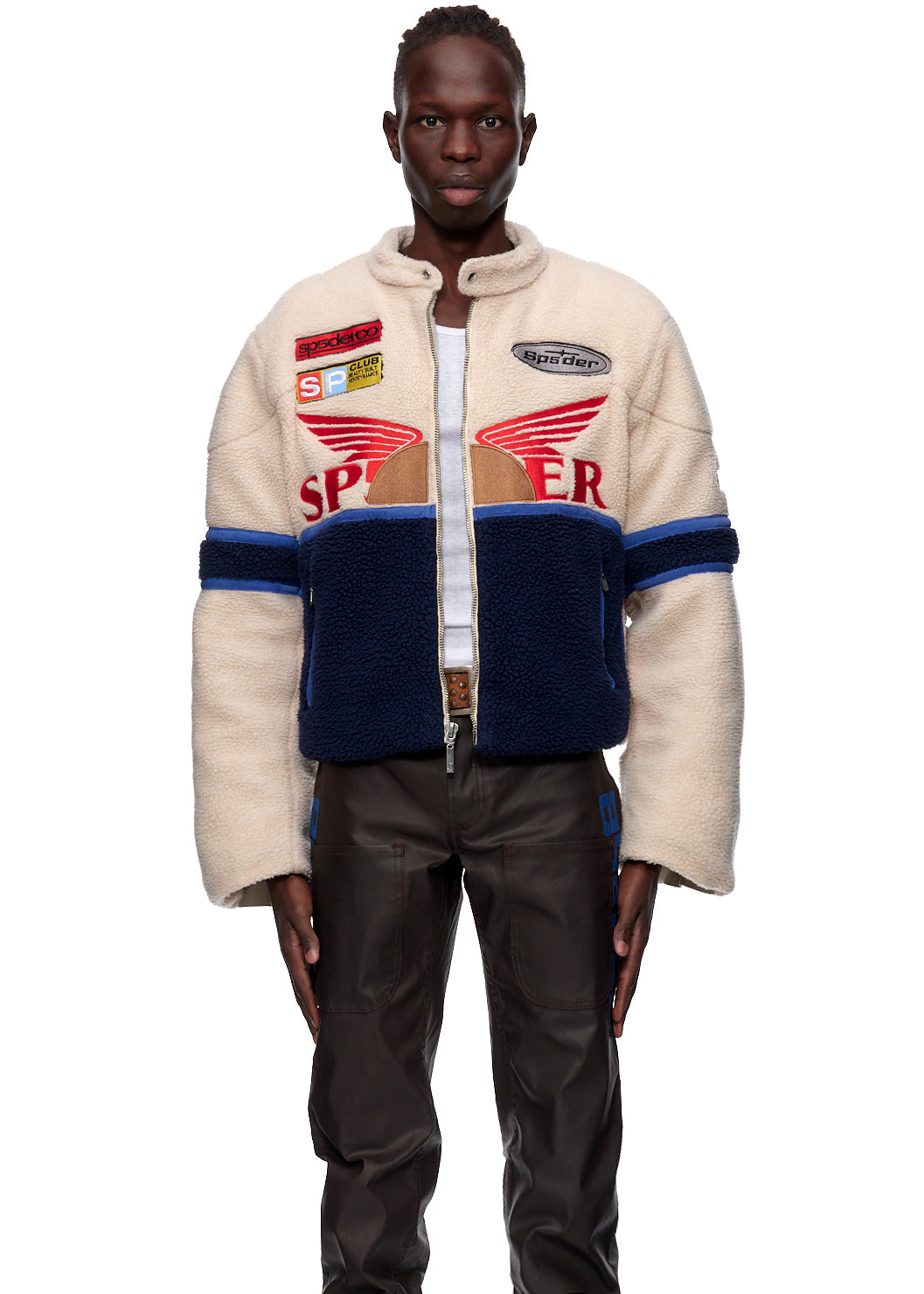 Detail view of SP5DER patch on Sherpa Cafe Racer in Beige