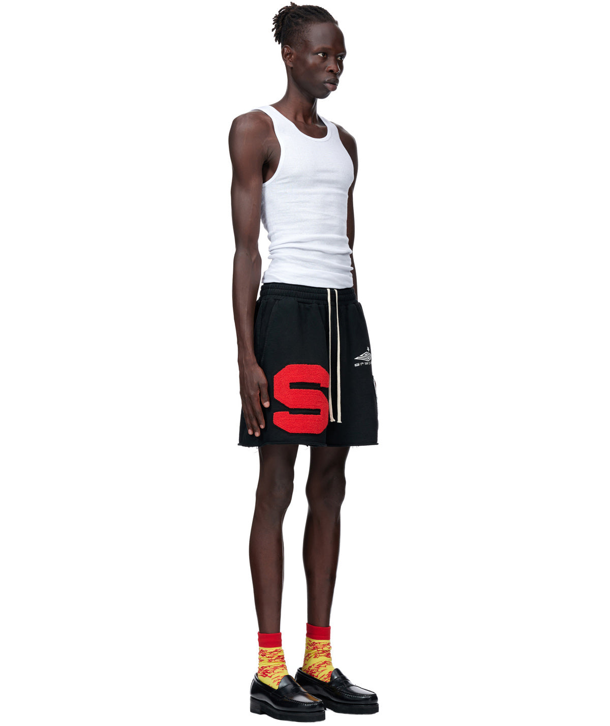 Side view of SP5DER Cut Sweatshort in Black