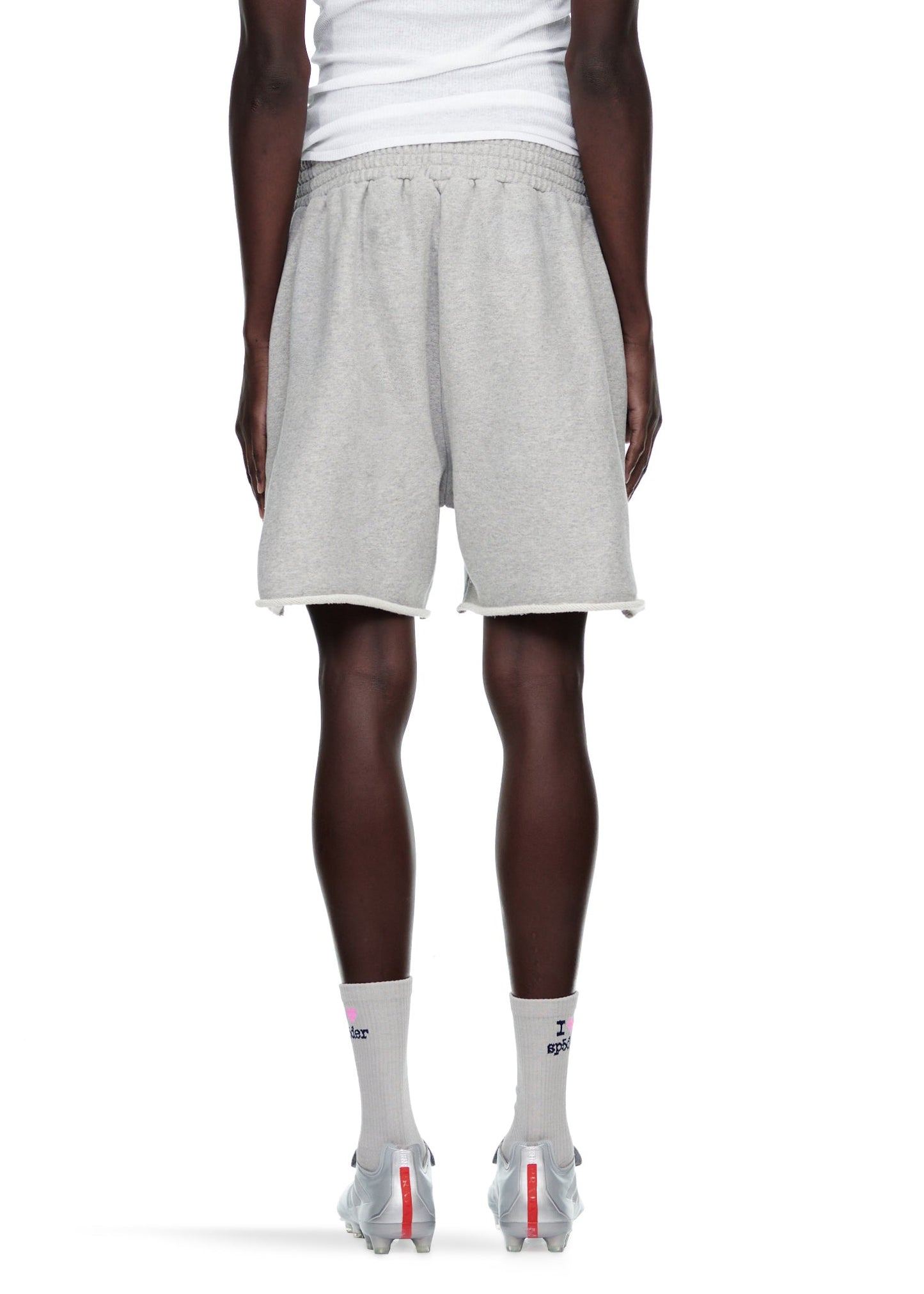 Detail view of star print on SP5DER sweatshort in Grey