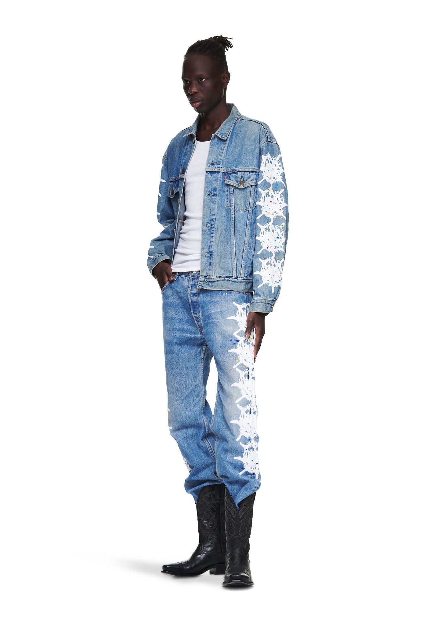 Detail view of silver button closures on SP5DER Vintage Web Denim Trucker Jacket in Blue