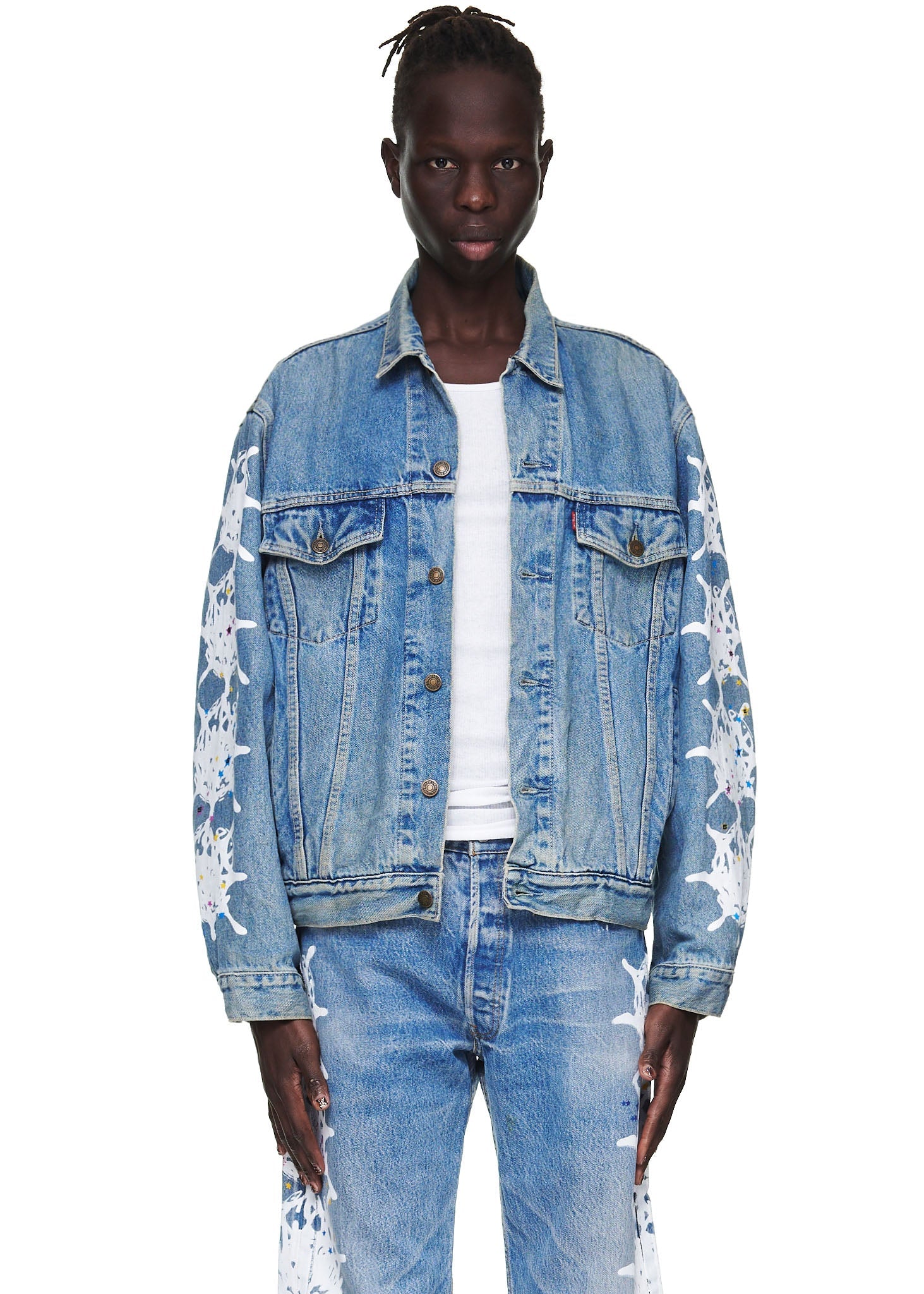 Detail view of leather branded back tab on SP5DER Vintage Web Denim Trucker Jacket in Blue