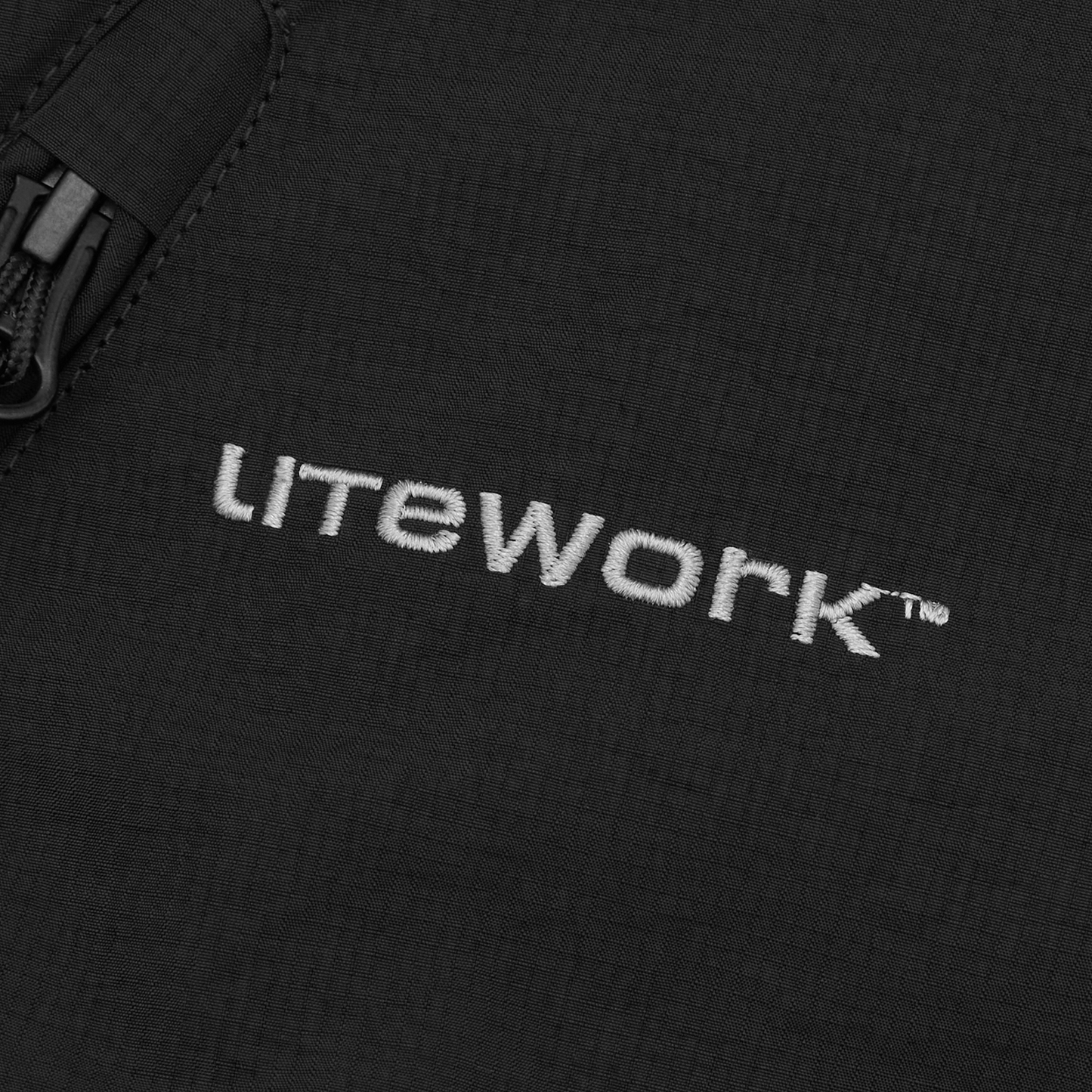 Corteiz Black Nylon Litework Quattro Jacket, close-up of contrast chest embroidery