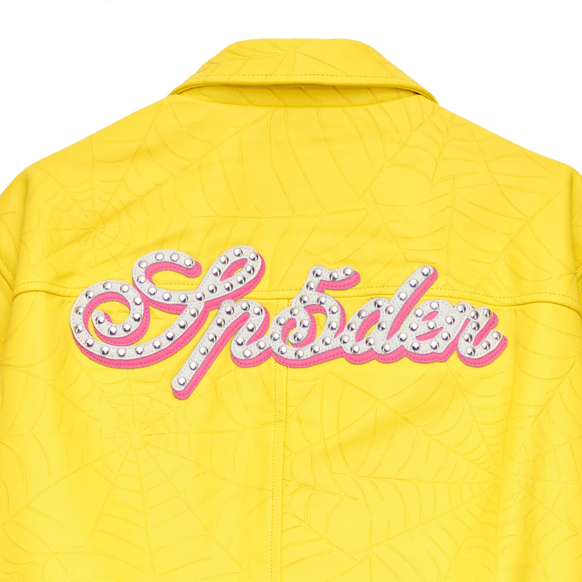 Detail view of debossed web design on SP5DER Debossed Web Leather Jacket in Yellow