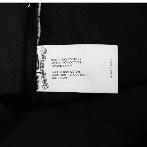 Chrome Hearts jeans with green and leopard cross patches