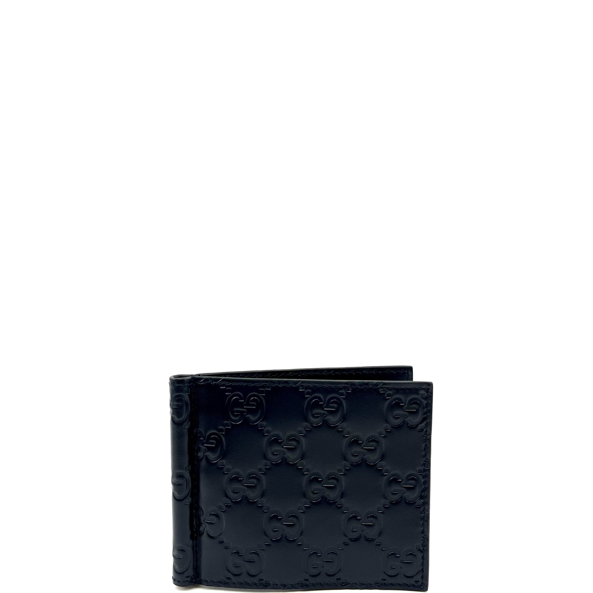 The wallet is open, revealing the six card slots