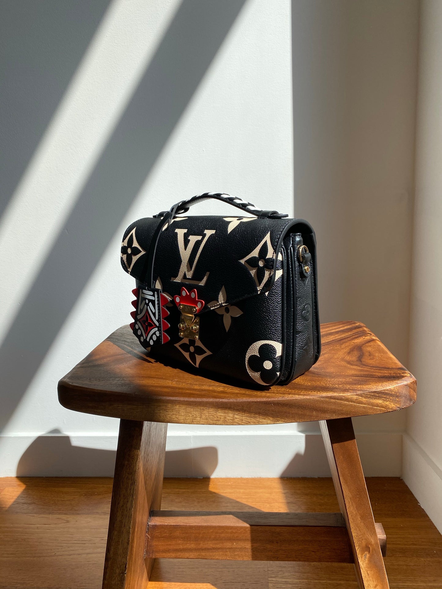 Louis Vuitton LV Crafty Pochette Metis Black Embossed Leather M45385