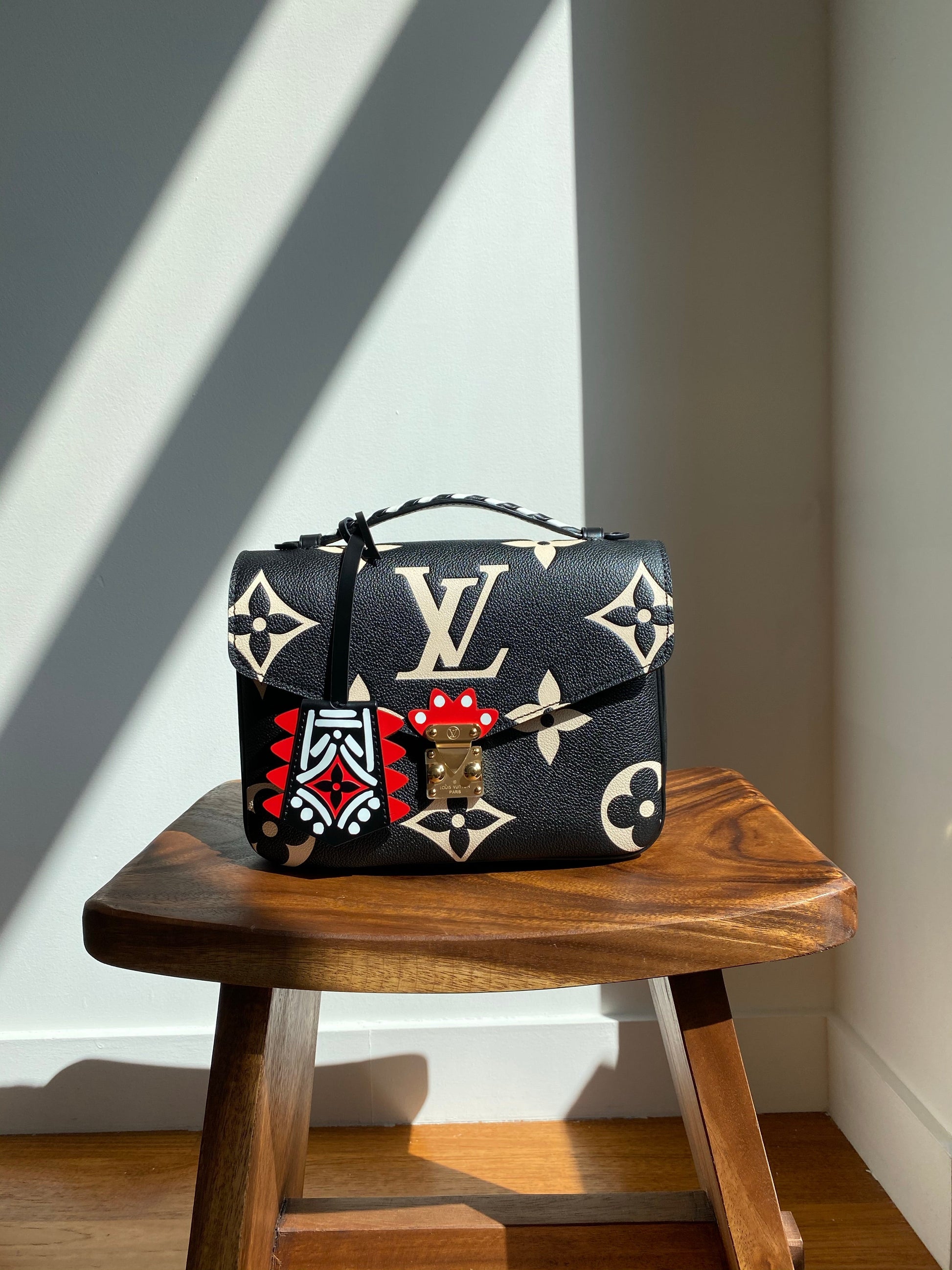 Louis Vuitton LV Crafty Pochette Metis Black Embossed Leather M45385