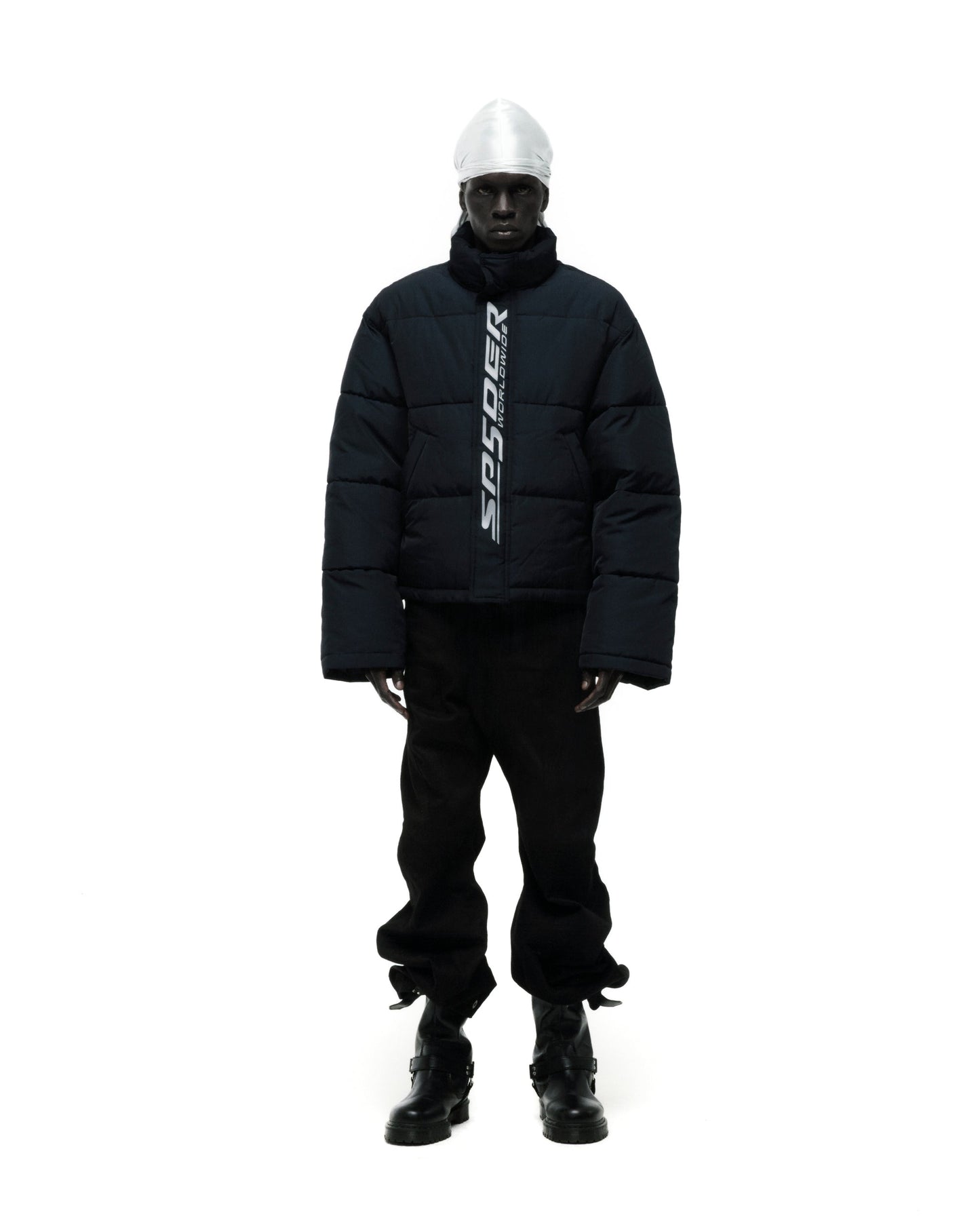 Model wearing SP5DER Trackhawk Puffer Jacket in Black