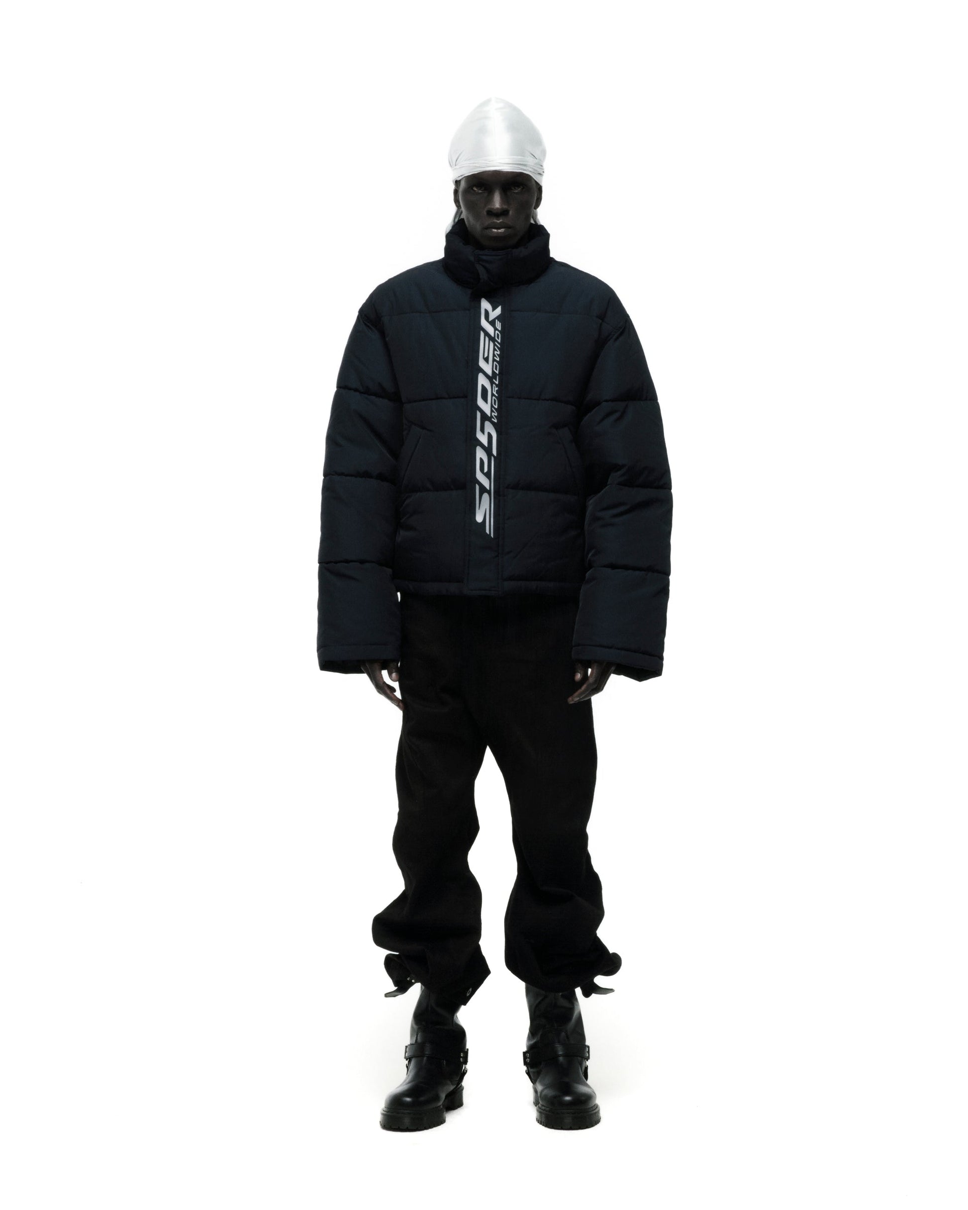 Model wearing SP5DER Trackhawk Puffer Jacket in Black