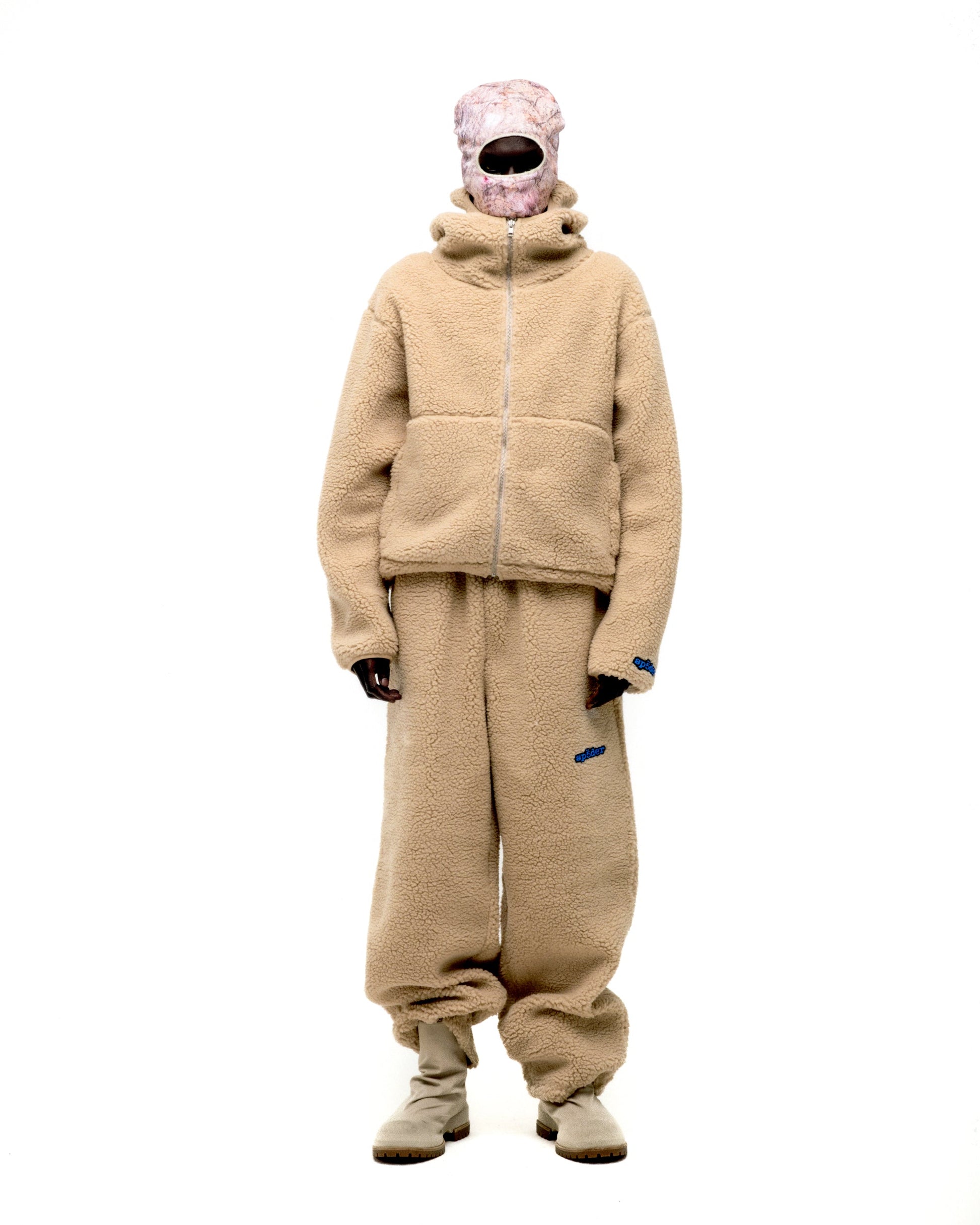Styled full look view of SP5DER Teddy Fleece Zip-Up in Brown