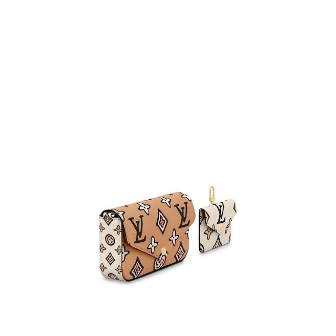 The Louis Vuitton pochette displayed upright, showcasing its full shape