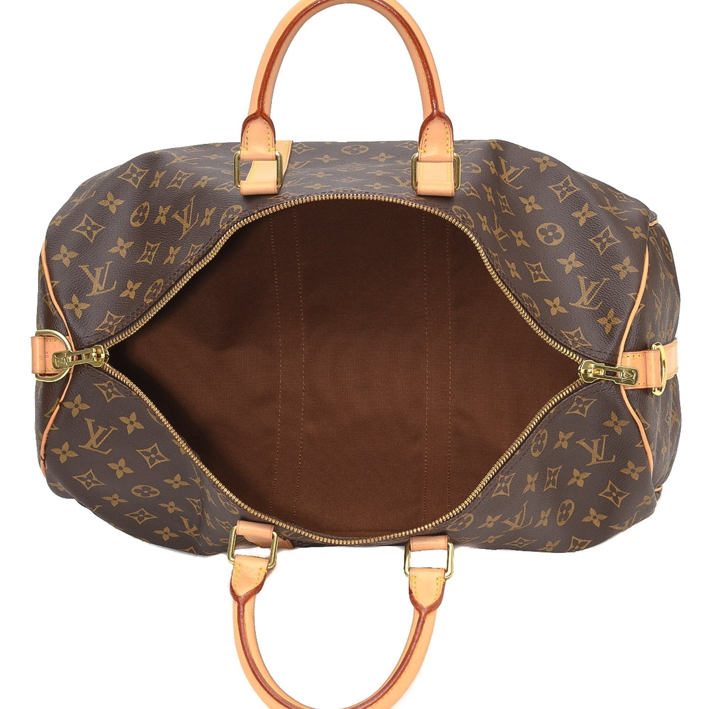 A shot of the monogram pattern next to the natural cowhide trim