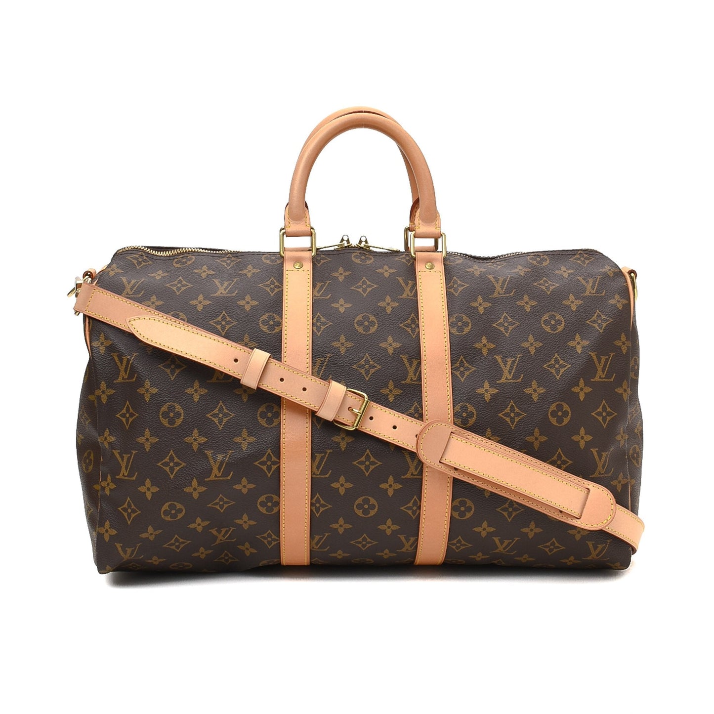 The bag in a travel setting, placed next to a suitcase
