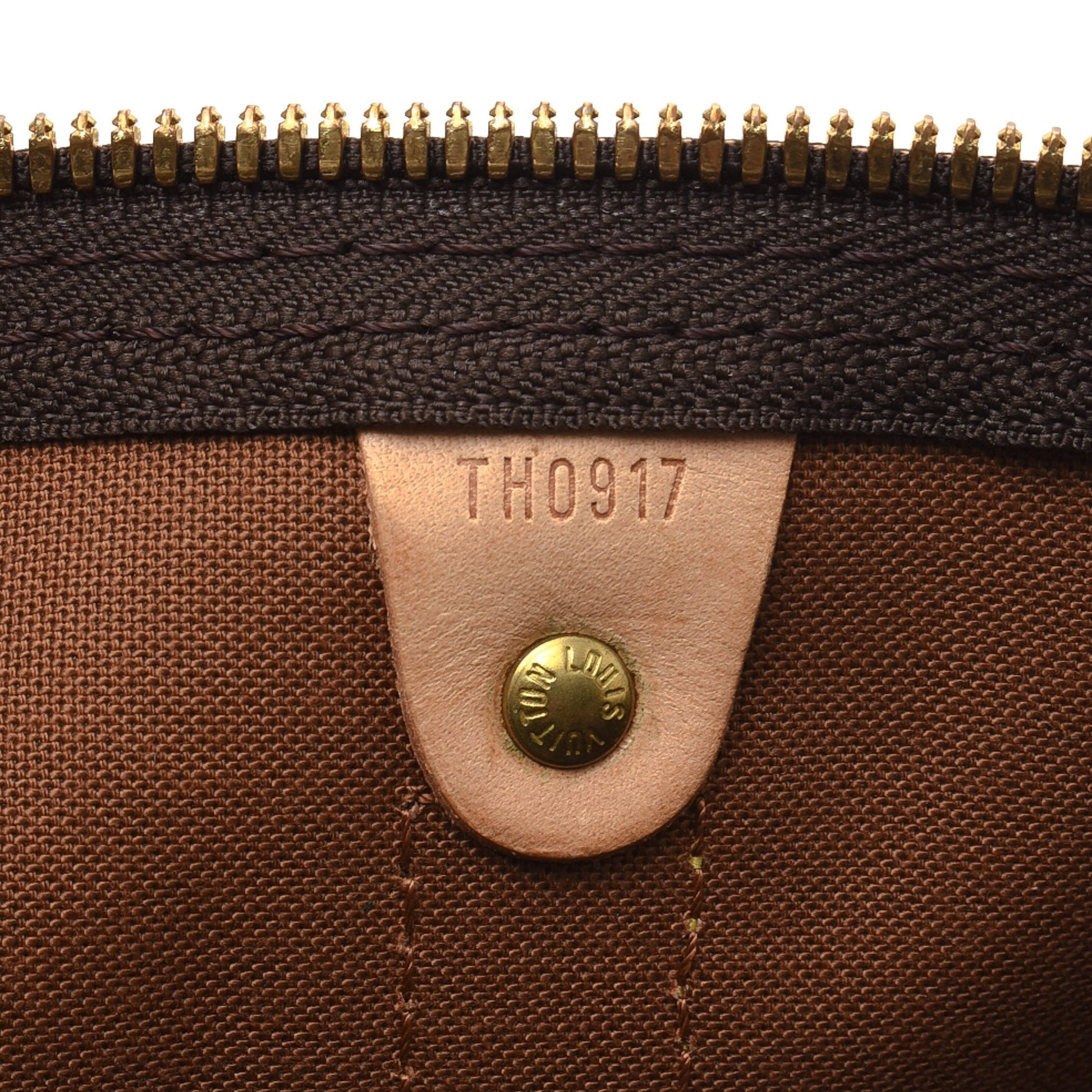 A detail shot of the zipper pull and closure mechanism