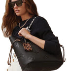An image highlighting the contrasting glossy monogram motif on the leather