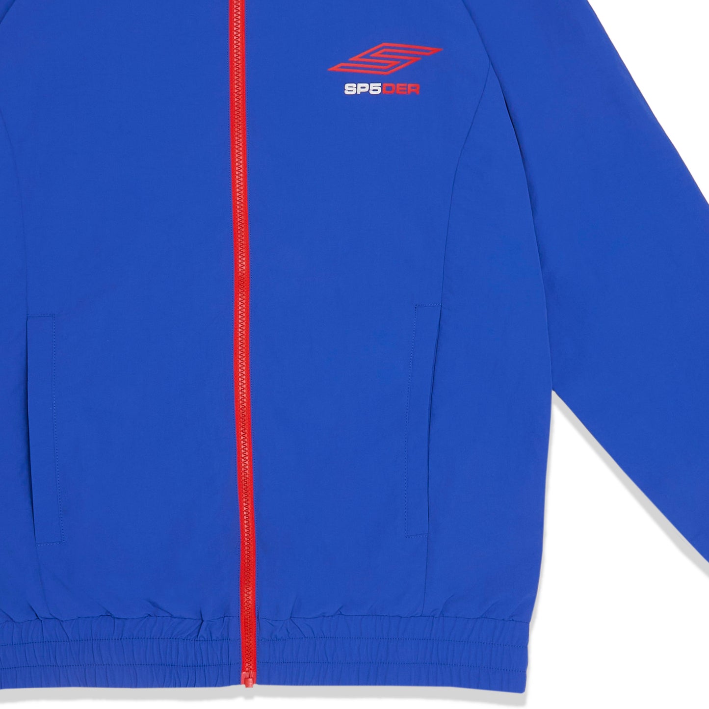 Detail view of SP5 Pro logo on SP5DER Pro Windbreaker in Blue